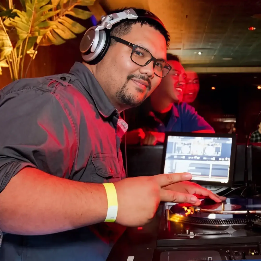 DJ CJ, founder of Ohana Entertainment, at the turntables